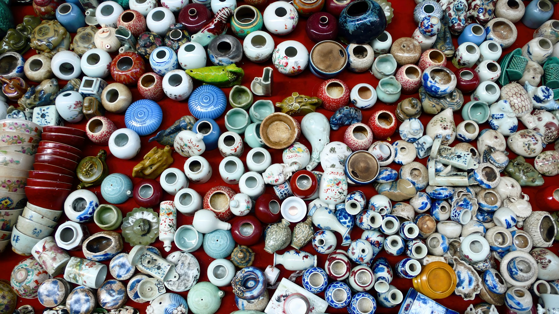 Collection of small ceramic pots and figurines