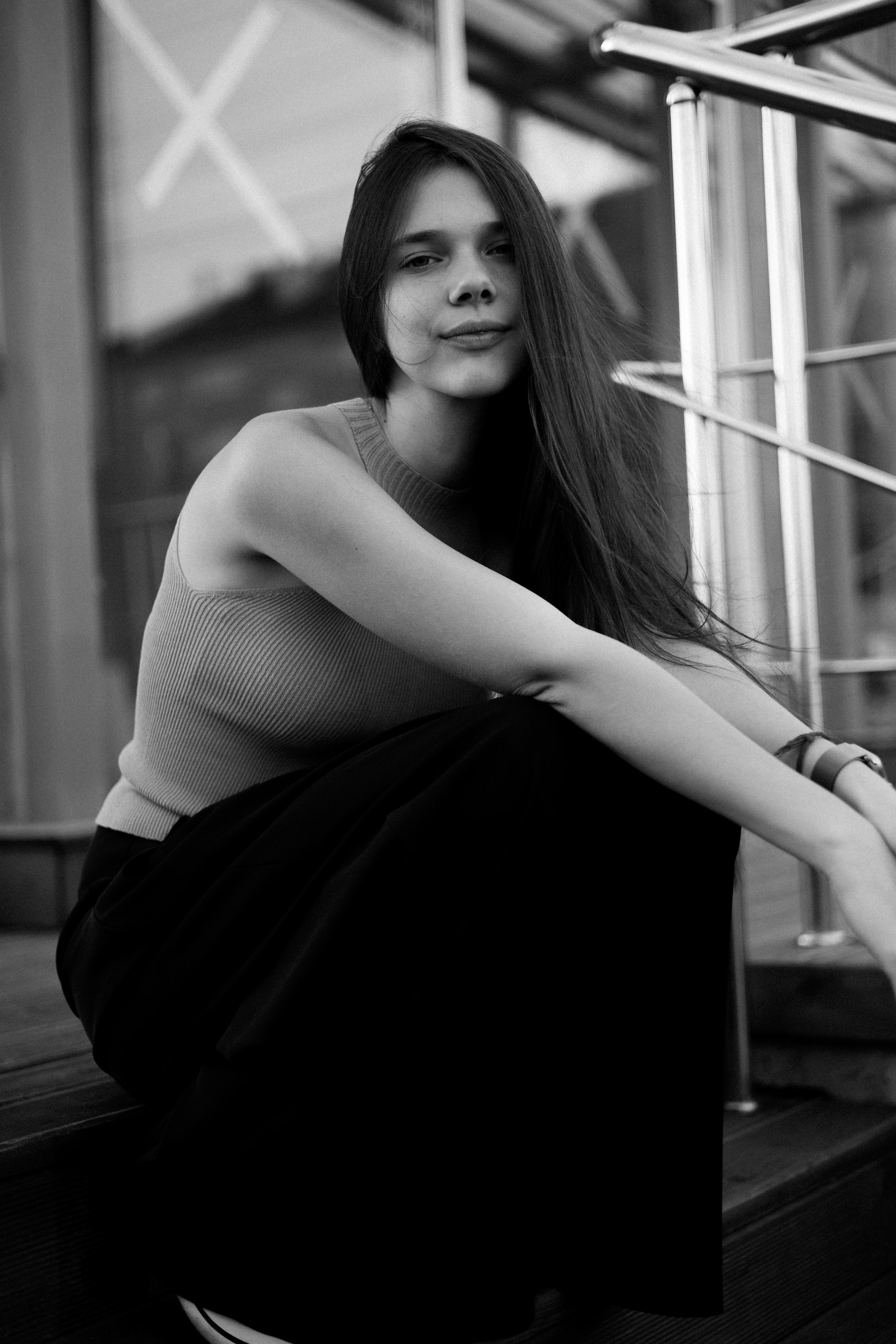A woman poses for the camera outdoors